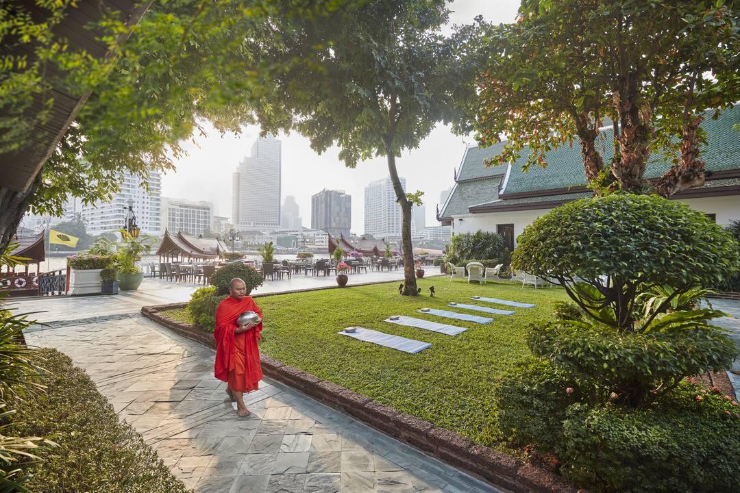 Monk in hotel gardens